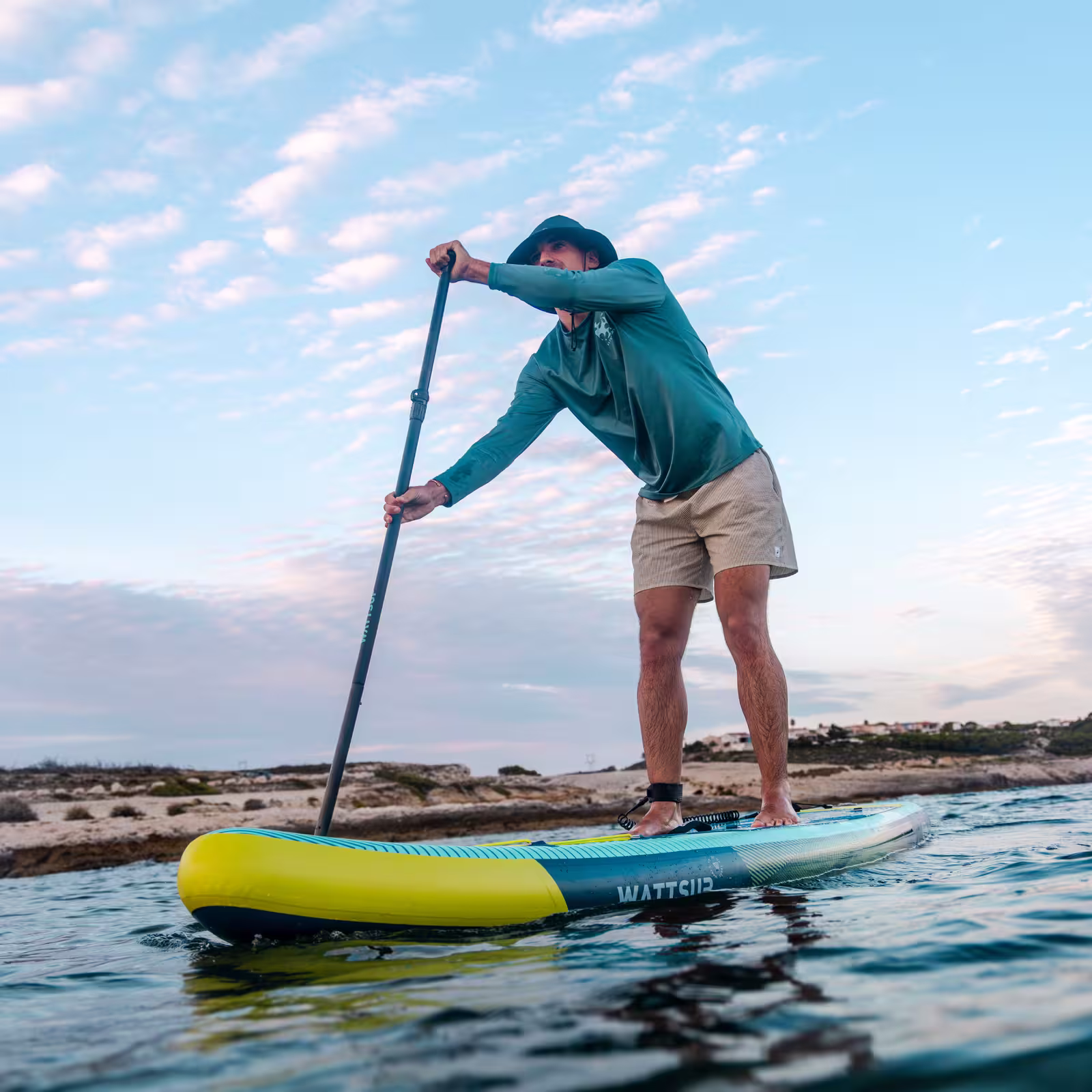 Paddler exploring calm coastal water on the WATTSUP Mora